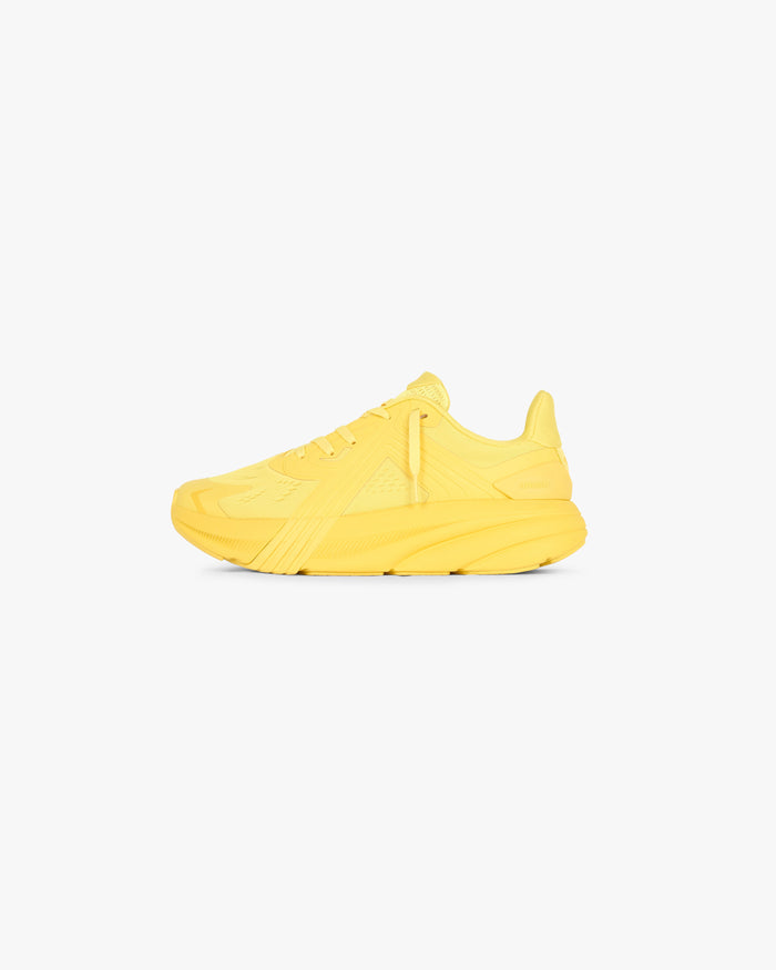 Model wearing mens yellow running shoes on a plain white background | 247 Arc-1 Runner in Yellow | Lightweight running shoes engineered for support and comfort | 247 Footwear | Represent Clo