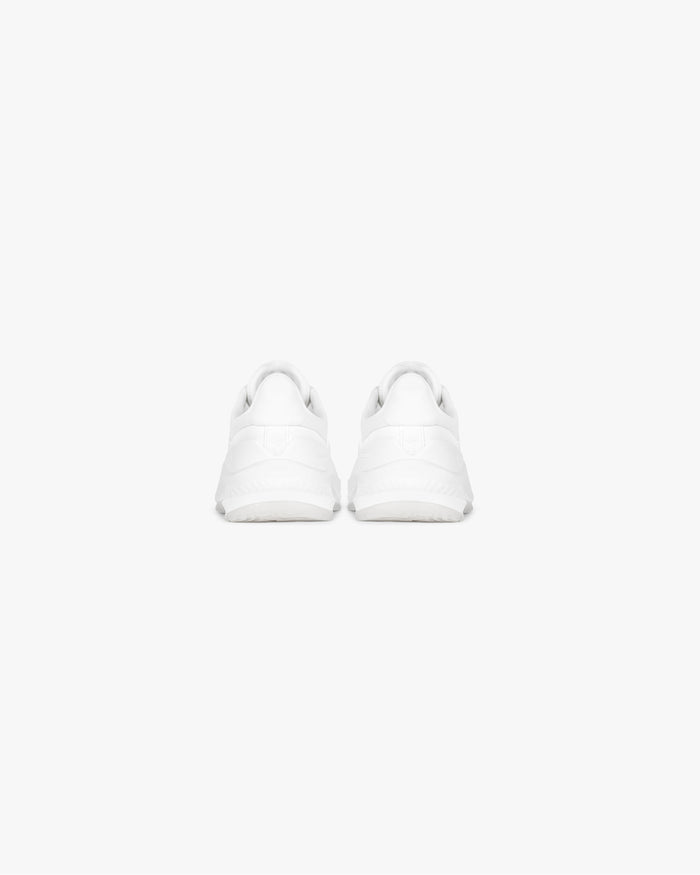 Detailed product image of a mens white trainer on a plain white background | 247 Arc-2 Trainer in Flat White | Trainer with engineered knitted upper and rubber outsole | 247 Footwear | Represent Clo