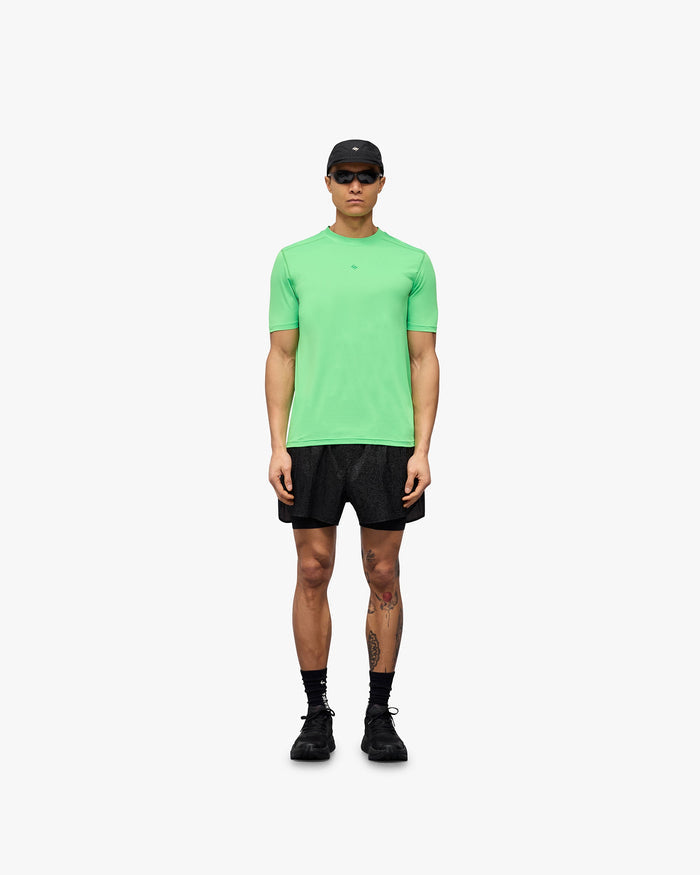 Man wearing a green running t-shirt on a plain white background | 247 Contour Run T-Shirt in Speed Green | Breathable running t-shirt with mesh construction | 247 T-Shirts | Represent Clo