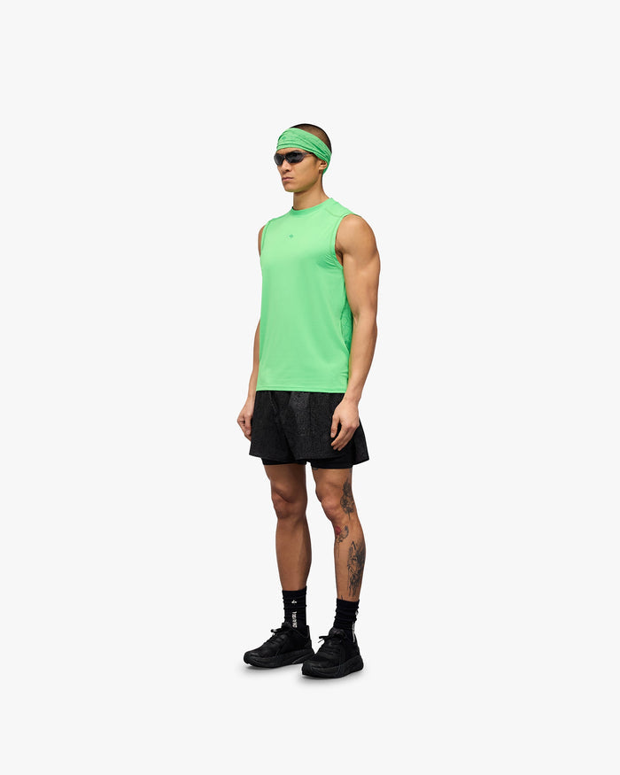 Man wearing a green running tank on a plain white background | 247 Contour Run Tank in Speed Green | Breathable mesh running tank with contour print | 247 T-Shirts | Represent Clo