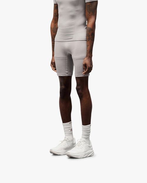 Back product image of mens grey shorts on a plain white background | 247 DNA Seamless Shorts in Titanium | Seamless shorts with flatlock stitching and compression support | 247 Shorts | Represent Clo
