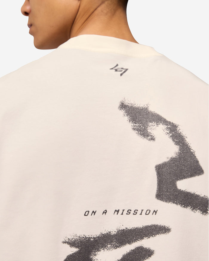 Man wearing a white tank top on a plain white background | 247 Motion Oversized Tank in Flat White | Oversized tank with sweat wicking capability | 247 T-Shirts | Represent Clo