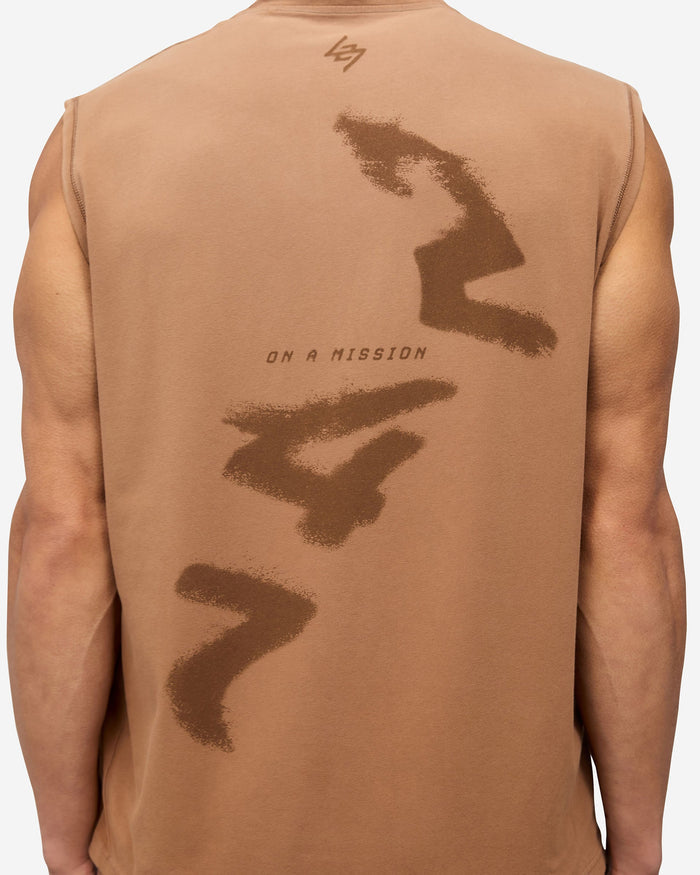 Man wearing an oversized rust tank top on a plain white background | 247 Motion Oversized Tank in Rust | Oversized tank with 2 way stretch and vintage aesthetic | 247 T-Shirts | Represent Clo