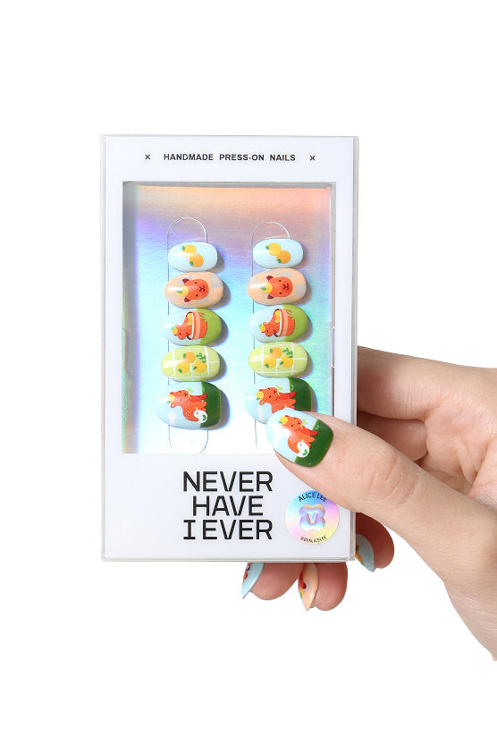 A capybara life by Alice Lee press-on nails feature cute capybara designs in a package by Never Have I Ever.