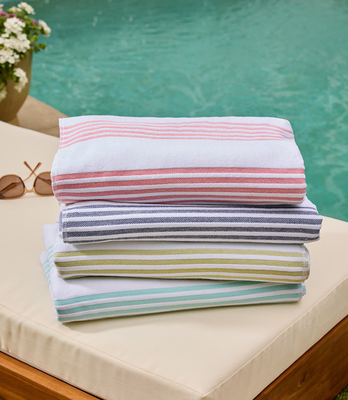 Aegean Stripe Beach Towel Multi Stack lifestyle poolside, Coral Navy Lime Aqua