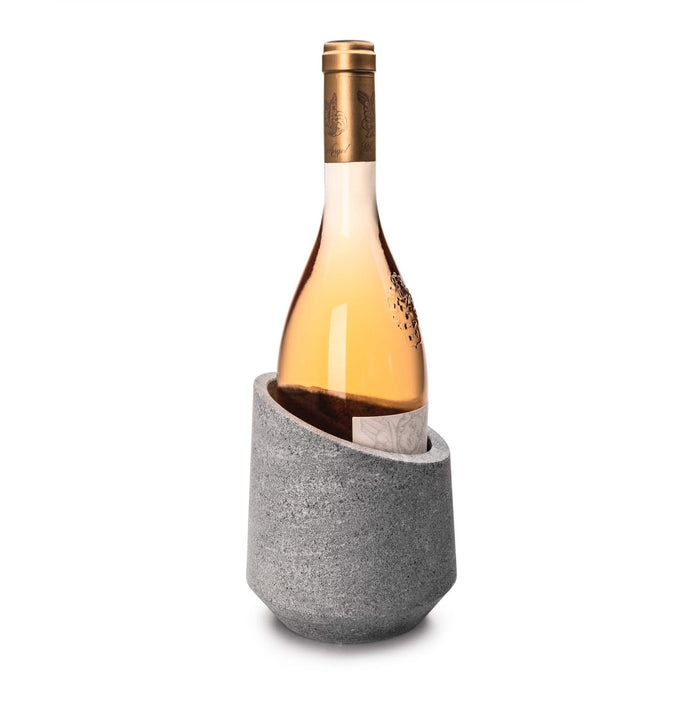Gray soapstone wine chiller holding a white wine bottle with bronze foil cap.