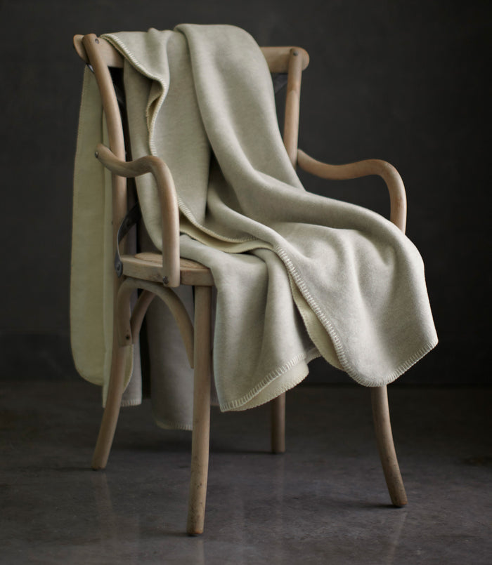 Alta Reversible Cotton Blanket On A Chair Pearl