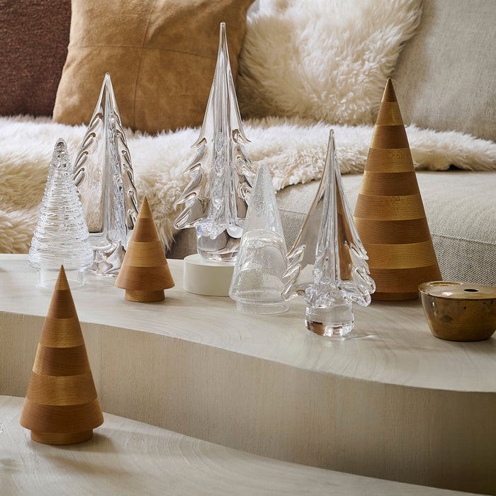 Collection of maple wood and glass cone-shaped decorative trees in natural and clear finishes.