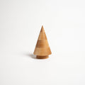 Wooden cone-shaped evergreen figurine in natural maple wood with a cylindrical base on white background.
