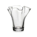 Clear glass vase with fluted sides and wavy rim opening.