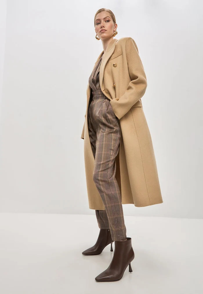 A stylish pair of brown stiletto heel ankle boots, known as Amy ankle boots, perfect for fashion-forward women.
