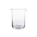 Clear glass bar pitcher with pouring spout and rounded cylindrical body.