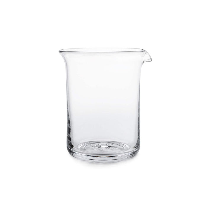 Clear glass bar pitcher with pouring spout and rounded cylindrical body.