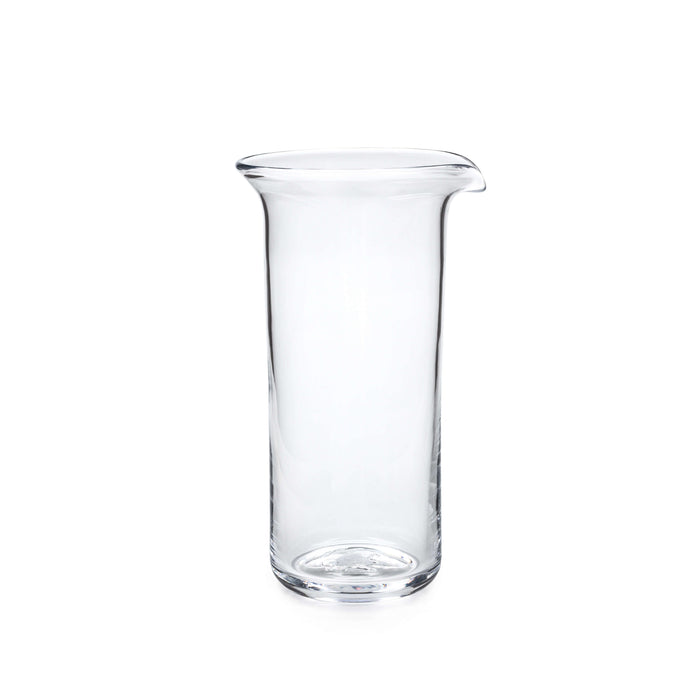 Clear glass pitcher with straight sides, pouring spout, and rounded rim.