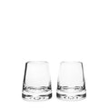 Two empty clear glass tumblers with thick bases side by side.