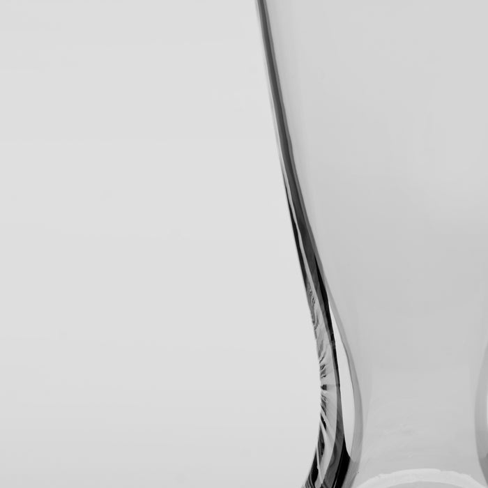 Two clear glass beer glasses with etched branding on a white background.