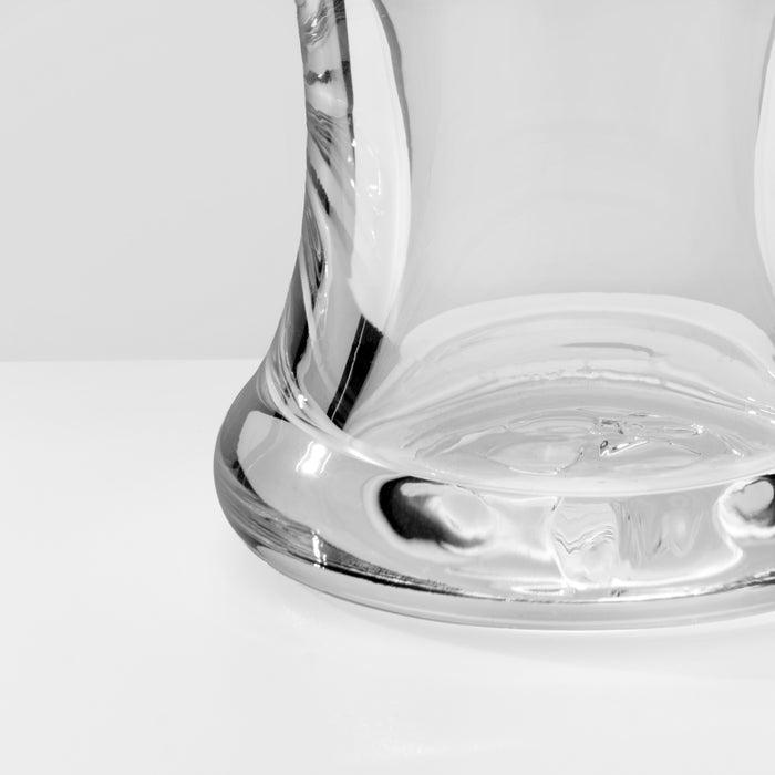 Two clear glass pilsner glasses with etched designs, shown from a close-up angle against a white background.