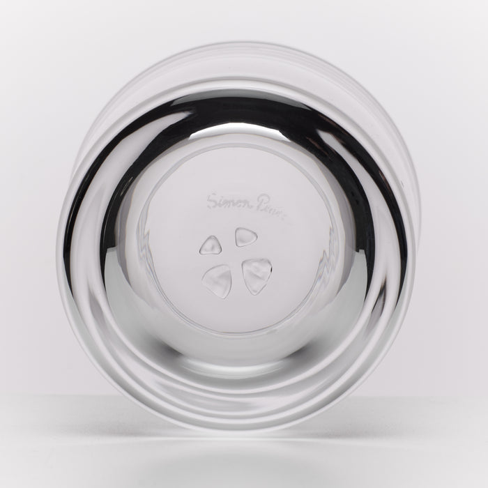 A round glass photographed from the bottom on a clean white background.