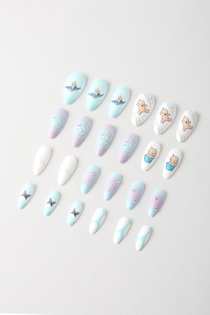 Aura Kewpie press-on nails with Kewpie character, floral, and butterfly designs.