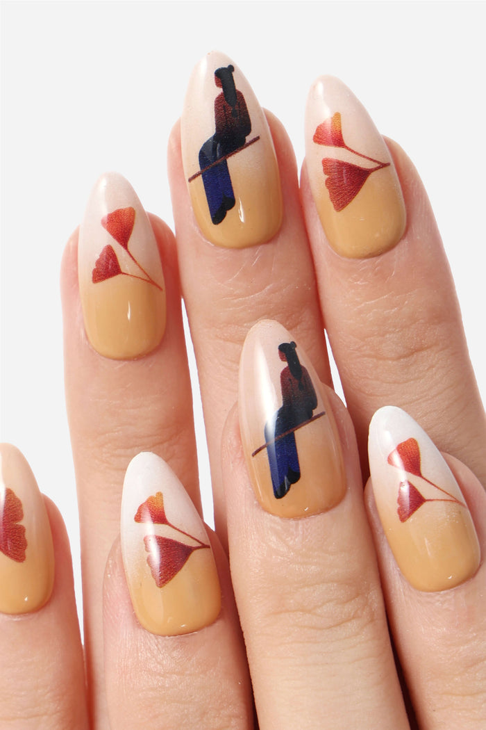Autumn Ginkgo press-on nails featuring ginkgo leaf designs and silhouettes on peachy-beige and tan bases.