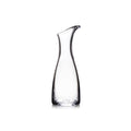 Clear glass carafe with curved sides and a pouring spout at the top.