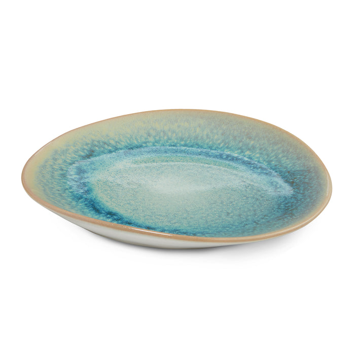 Shallow ceramic plate with lagoon blue glaze and tan rim.