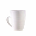 White ceramic mug with curved handle on white background.