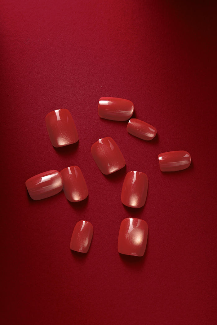 Basic but Make It Boss square press-on nails in a deep red, glossy finish with subtle shimmer.