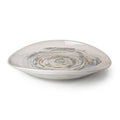 Sand-colored ceramic serving platter with swirled gray and white design in shallow bowl shape.