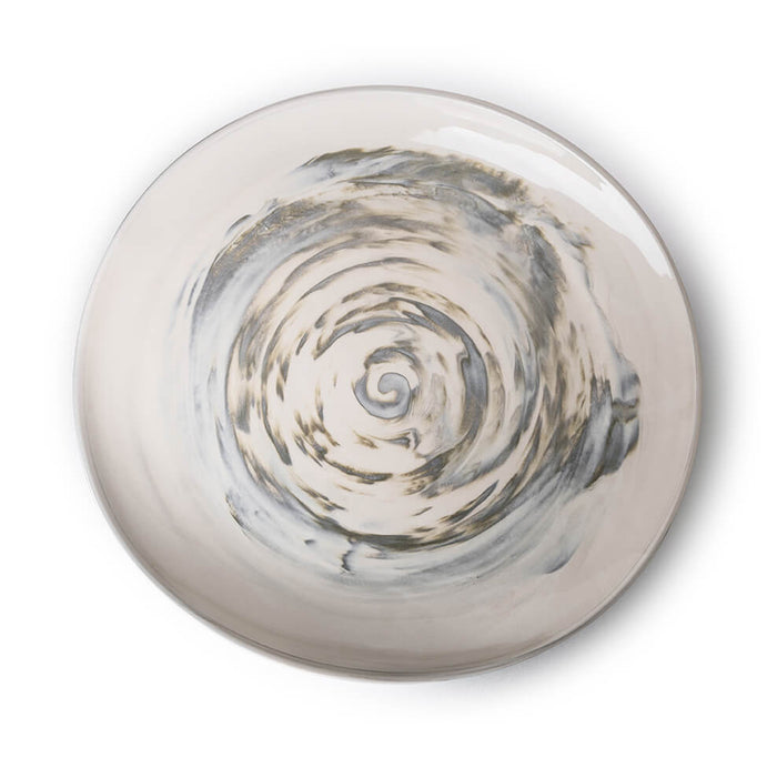 Sand-colored ceramic serving platter with spiral shell design in center and glazed finish.