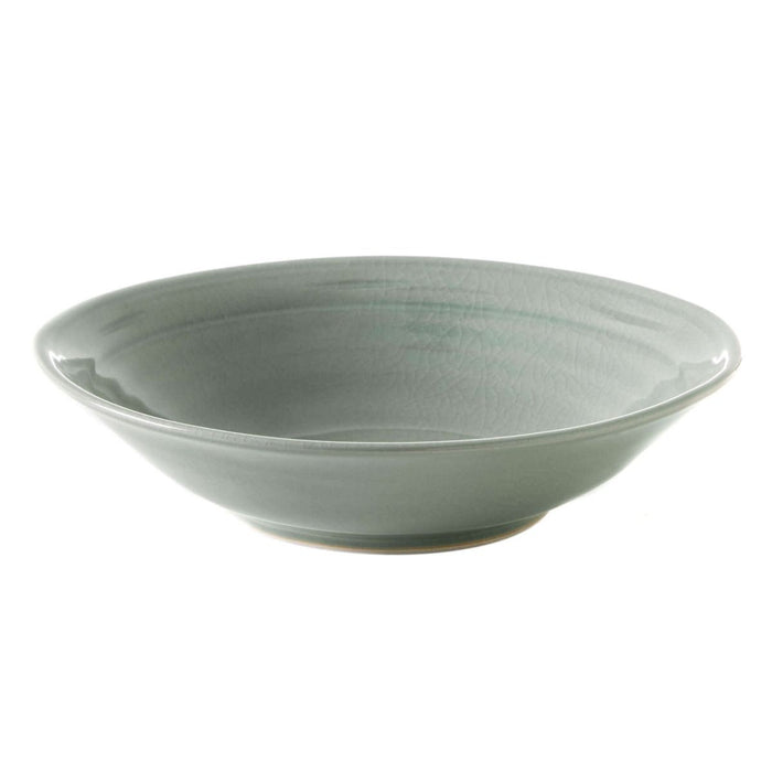 Celadon bowl with crackle glaze texture and shallow curved sides.
