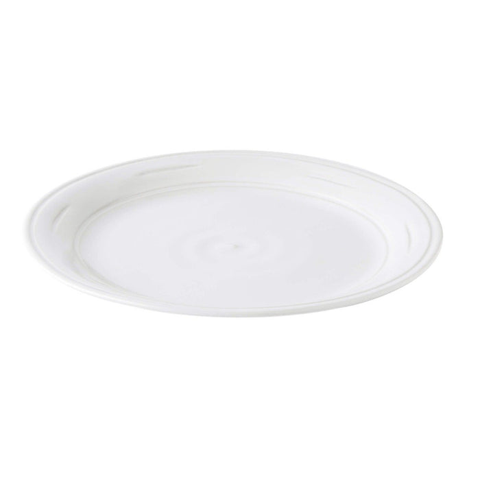 White ceramic dinner plate with concentric rim detail and glazed finish.