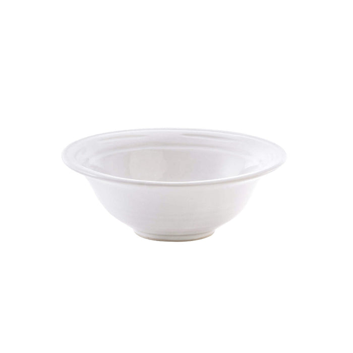 Cream-colored ceramic cereal bowl with wide rim and curved sides.