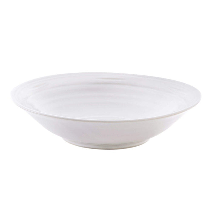 White ceramic bowl with concentric circular ridges and a wide shallow shape.
