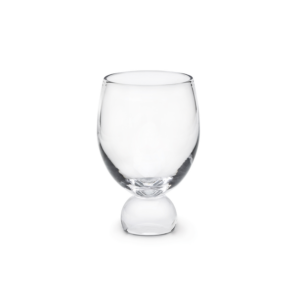 Clear glass tumbler with rounded bowl shape and solid spherical base.