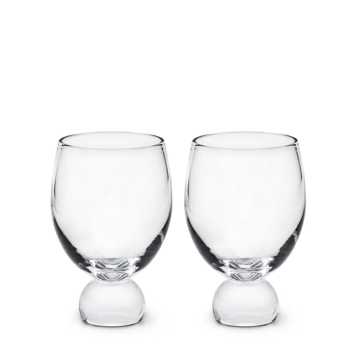 Two clear glass tumblers with rounded bases and wide bowls, displayed side by side.