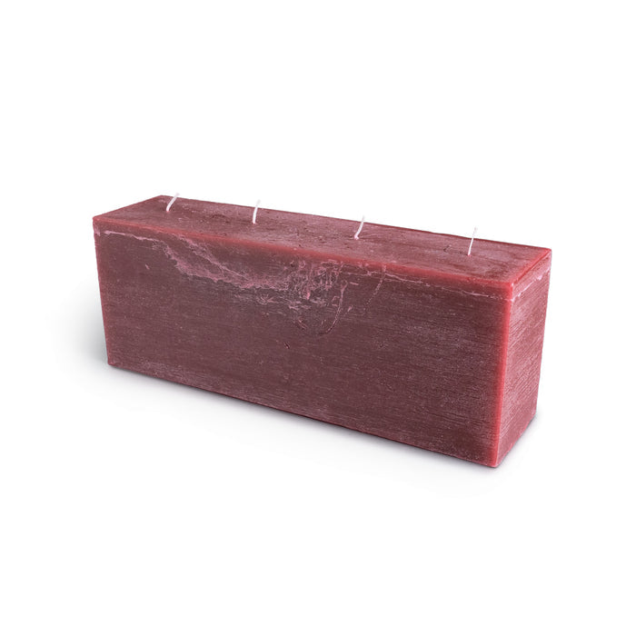 Berry-colored rectangular candle with four white wicks along the top surface.