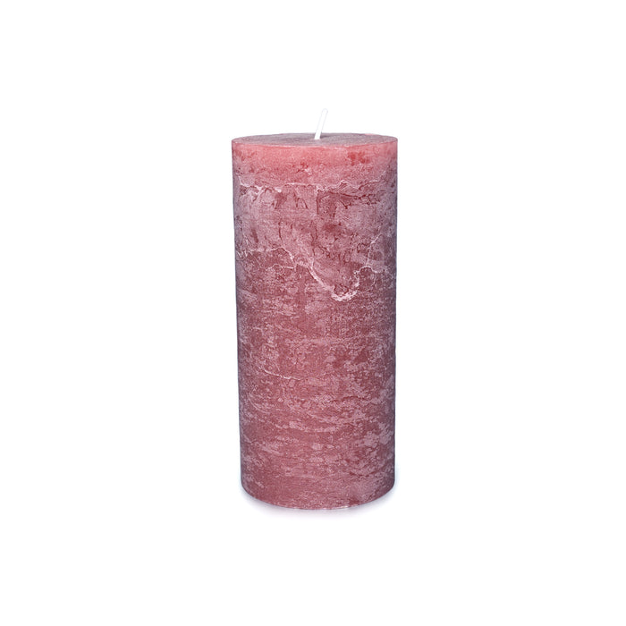 Cylindrical pillar candle in dusty rose pink with textured surface and white wick.