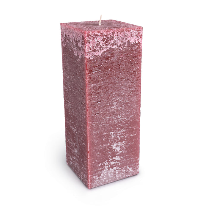 Berry-colored square pillar candle with textured wax surface and white wick on top.