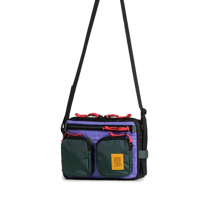 Front quarter view of Topo Designs Block Bag in "Very Peri / Forest"