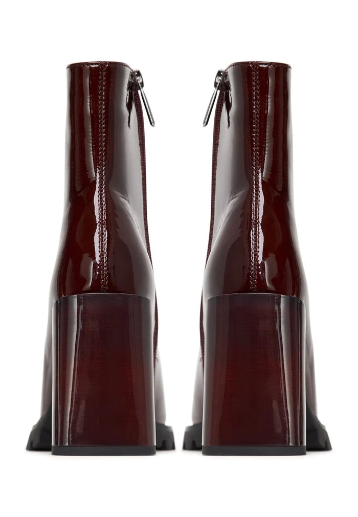 A stylish pair of red block heel Helen boots, perfect for any fashion-forward woman's footwear collection.