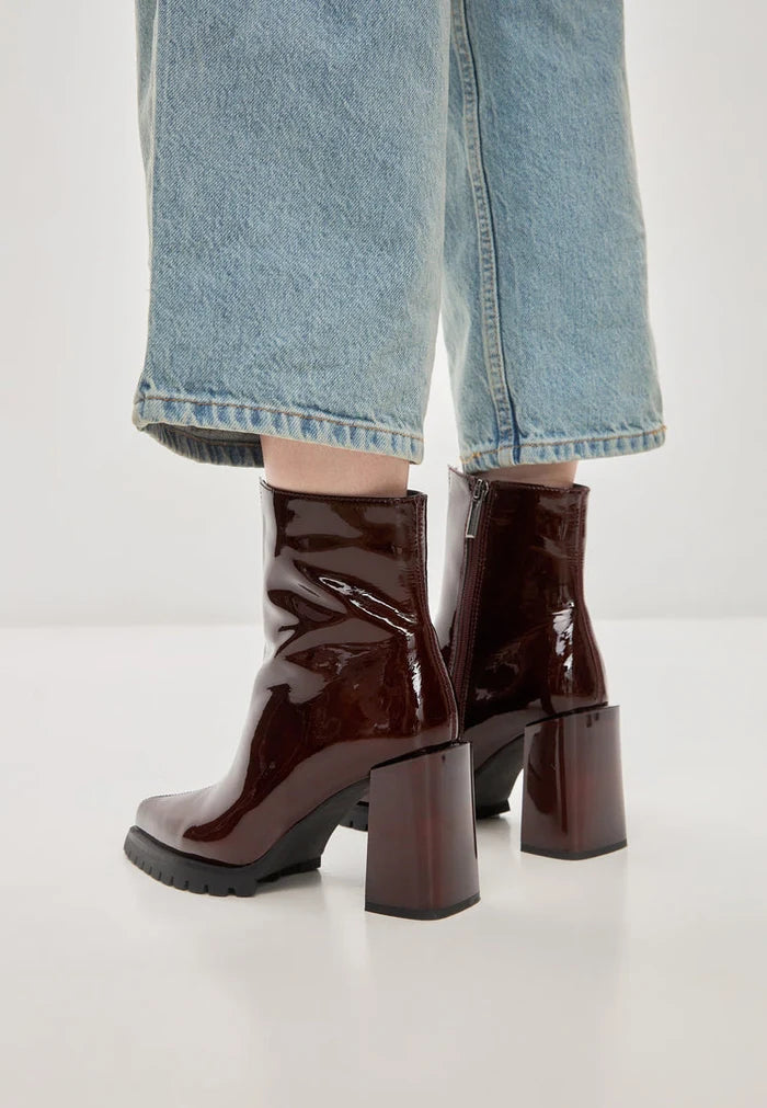 A stylish pair of red Helen block heel boots for women, ideal for adding a pop of color to your fashion footwear collection.