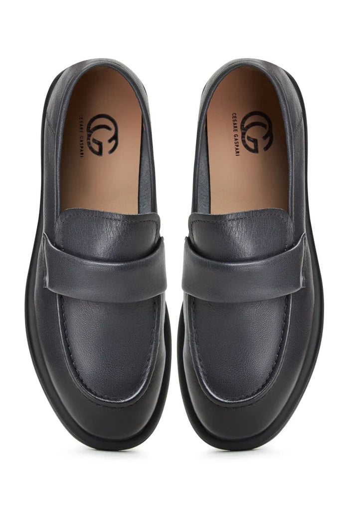 A stylish pair of grey block heeled loafers from the Stephanie brand, perfect for women looking for chic and comfortable slip-on shoes.