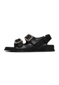A stylish pair of bold black buckle wedge sandals for women, perfect for making a fashion statement.