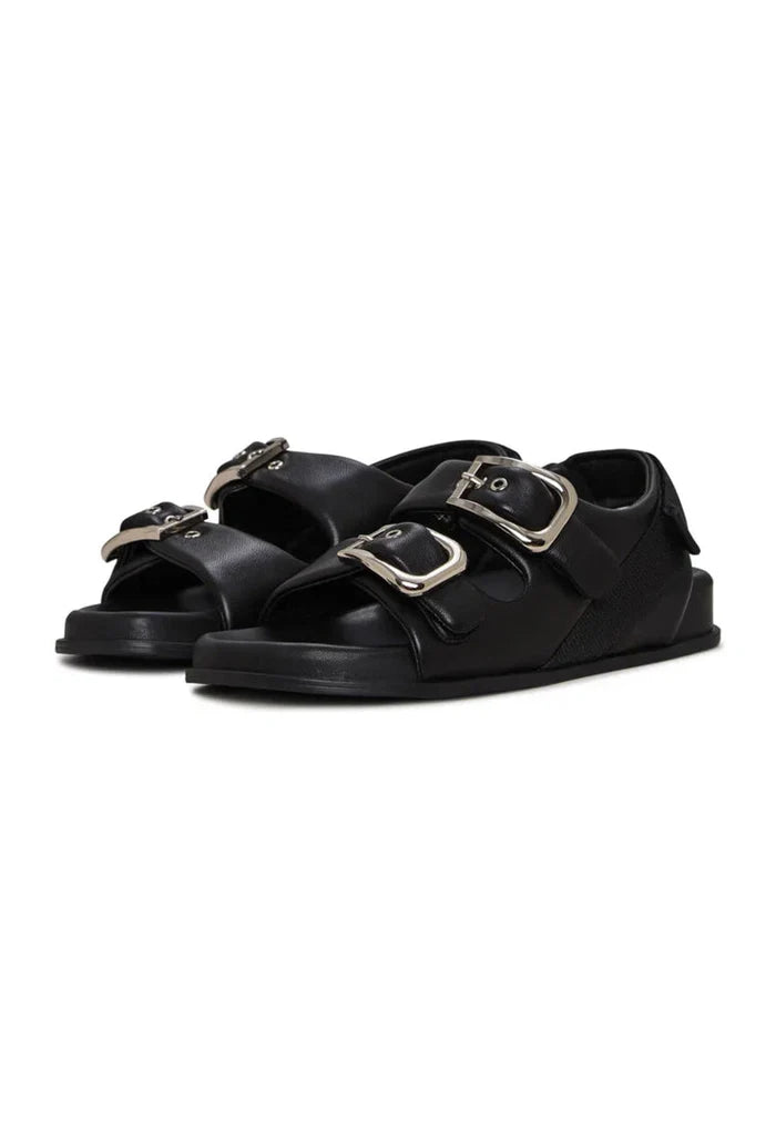 A fashionable pair of black wedge sandals with bold buckle detailing for women's shoes fashion.