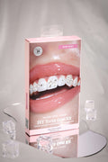 Bow Baby DIY Tooth Gem Kit packaging featuring a close-up of a smiling mouth with applied tooth gems and bow designs.