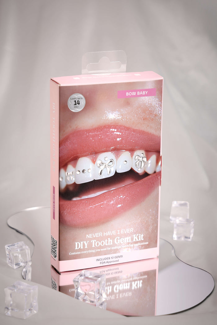 Bow Baby DIY Tooth Gem Kit packaging featuring a close-up of a smiling mouth with applied tooth gems and bow designs.