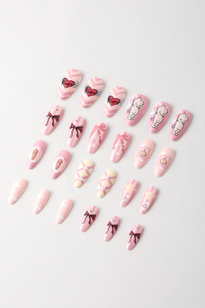 Pink press-on nails with Kewpie character, bows, and heart designs