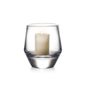 Clear glass hurricane vase with cream pillar candle inside.
