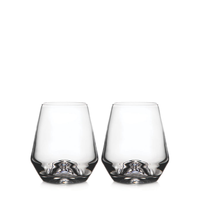 Two clear stemless wine glasses with tapered sides and rounded bases.